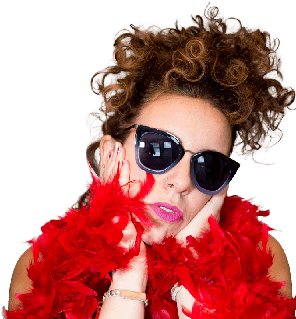 Image of Jill wearing sunglasses and a bright red boa.